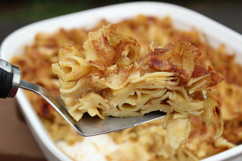 Noodle Kugel with Cinnamon and Raisins (close up on spatula)| www.tastyoasis.net