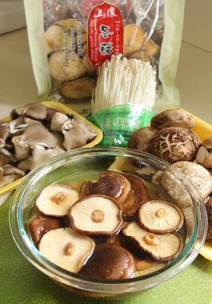 Soaking Shitake Mushrooms: Fuchsia Dunlop's Sour and Hot Mushroom Tofu Soup is a healthy, lighter version of a Chinese take-out favorite. With four types of mushrooms, it's hearty enough as its own meal, or the perfect compliment to a feast. It's comforting and impressive, and this large batch will leave you with plenty to freeze for future bowls. | www.tastyoasis.net