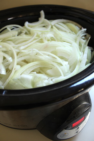 These Slow Cooker Caramelized Onions take less than ten minutes of prep work, and result in a sweet flavorful yield that can be used in a variety of dishes. Make a big batch, then freeze small packages for last minute cooking. | www.tastyoasis.net