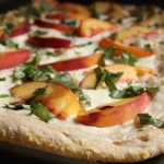 This Peach, Ricotta and Basil Pizza tastes like summer. At once creamy, sweet and salty, every bite is balanced, so this quick and easy dish is perfect on its own, or served as an appetizer for company. | www.tastyoasis.net